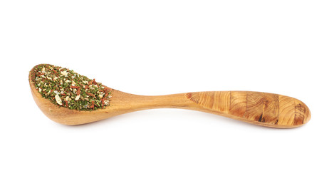 Wooden spoon full of italian spices
