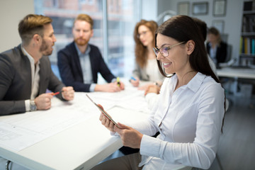 Fototapeta premium Cheerful coworkers in office