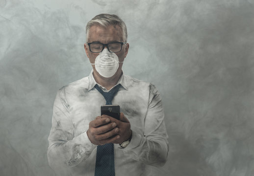 Businessman having a phone call and toxic smog