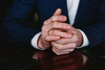 Obraz premium hands with the groom's