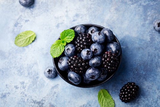 Fresh blueberry, blackberry berries, mint leaves