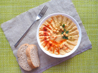 Vegetarian diet food. Classic hummus on a plate.
