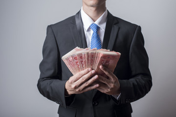  Business man holding China money