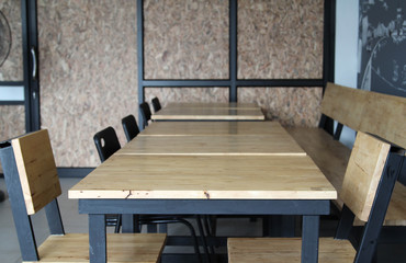 Wooden table and chair in restaurant.