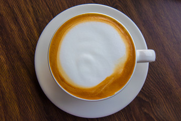 The cup of coffee.