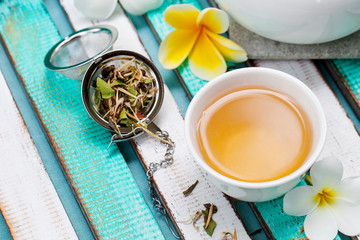 Herbal green tea in white cup. Copy space.