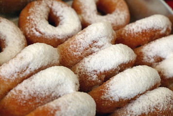 Fototapeta na wymiar Close up many ring donuts with sugar powder