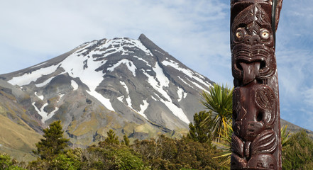 Maori statue in front of Volcano Taranaki, New Zealand