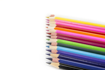 Sharpened colored pencils on the white background