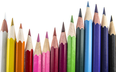 Sharpened colored pencils on the white background
