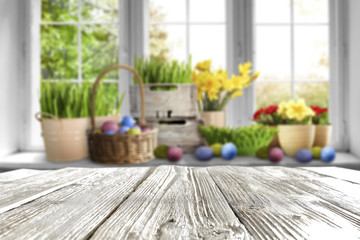 blurred window of easter time and desk of free space 