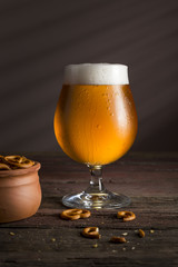 Unfiltered light beer and pretzels