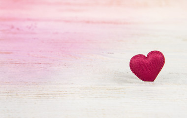Fototapeta premium Valentine's day heart on textured wooden table