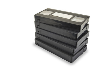 Pile of black vhs videotapes on the white background