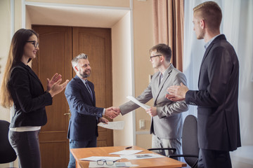 handshake at the signing of the contract in the office of businessmen