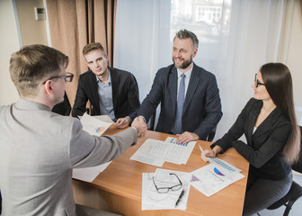 handshake at the signing of the contract in the office of businessmen