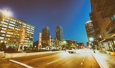 Obraz premium BOSTON, MA - OCTOBER 17, 2015: City streets at night. Boston is visited by 15 million tourists every year