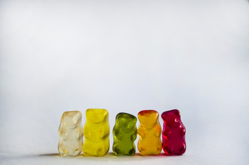 colorful gummy bears or jelly bears in on white background