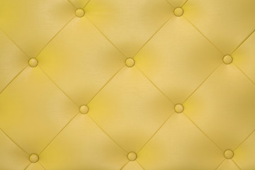 Yellow leather surface.