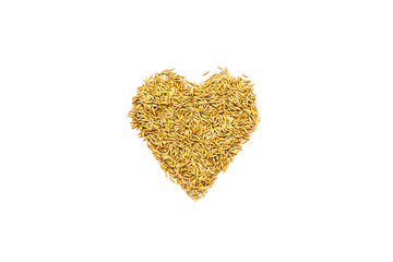 Raw oats in shape of heart on white background top view copy space