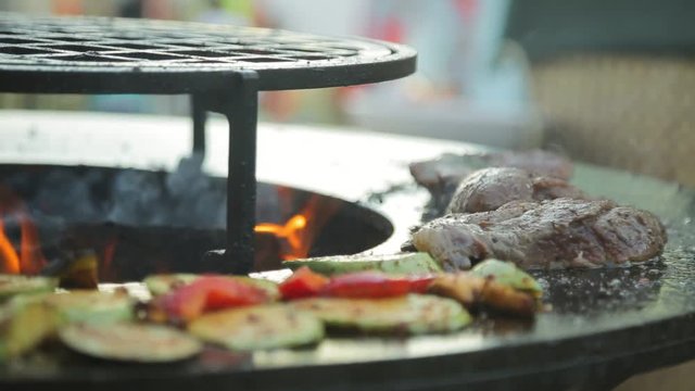 Pieces of meat and vegetables fried on barbecue