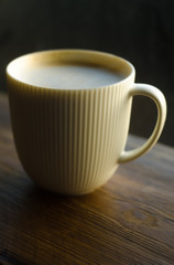 Cup of Coffee on Wooden Table with Copy Space