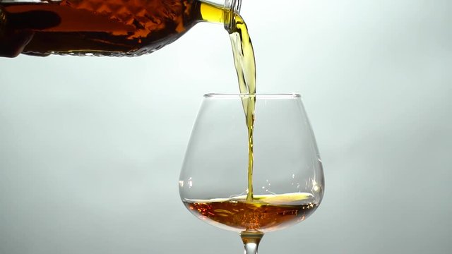 From a decanter in a glass pour cognac