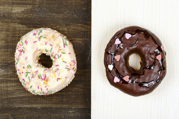 A light and dark donut on dark and light surface