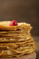 Many thin pancakes on the table