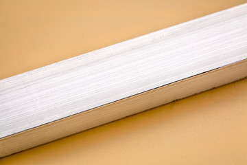 aluminum bar on beige background