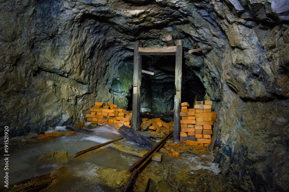 Wall mural underground abandoned ore mine shaft tunnel gallery with blocks