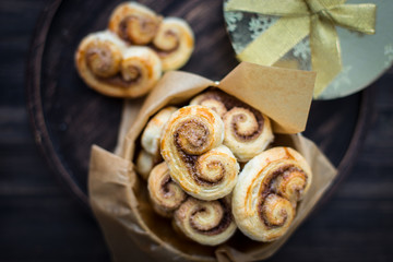 Cookies, curlicues, pretzels of puff pastry with sugar and cinnamon