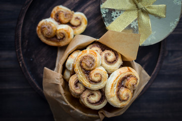 Cookies, curlicues, pretzels of puff pastry with sugar and cinnamon