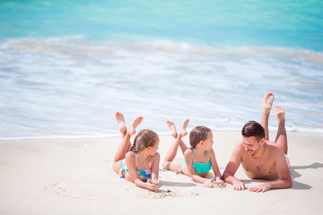 Father and kids enjoying beach summer tropical vacation