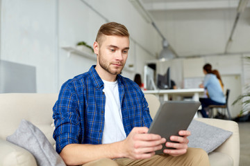 man with tablet pc working at office