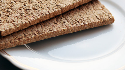 The healthy crispbread on a white plate