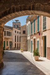 Fototapeta na wymiar Mallorca - Santanyi - La Porta Murada - View through the city gate into the old town - 5626