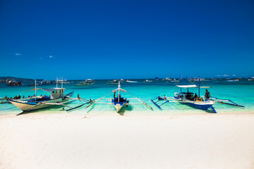Fototapeta na wymiar Boat at famous White Beach on Boracay Island, Philippines.