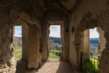 Fototapeta na wymiar Monterano (Italy) - A ghost medieval town in the country of Lazio region, located in the province of Rome, perched on the summit plateau of the hill tuff.