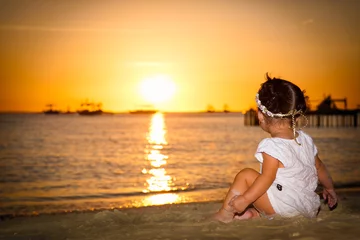 Papier Peint photo Plage blanche de Boracay Baby gazing on the sunset at White beach ,  Boracay island. Philippines.