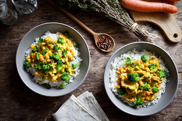 Two Bowls Of Pork And Broccoli Stir Fry