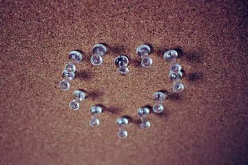 Heart. Heart of button on a brown background.
