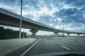 Highway and viaduct under the blue clouds