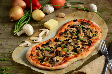 Italian pizza with mozzarella cheese, mushrooms,  black olives and green onion 