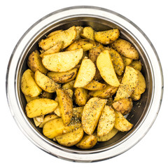 Raw potatoes with spices, sliced slices