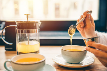 woman drink hot orange tea