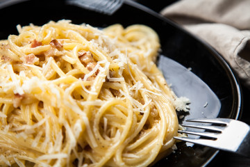 Spaghetti carbonara with egg and pancetta
