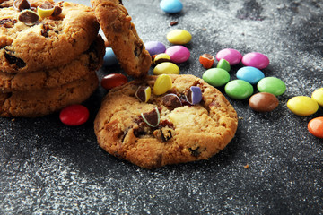 Chocolate cookies with colorful candies. Chocolate chip smarties cookies.