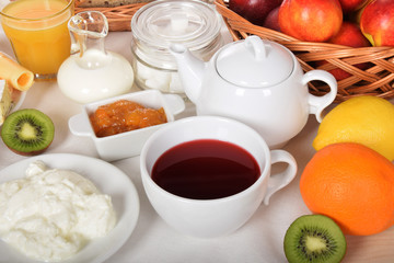 creamy white cream cheese with orange juice and kiwi orange and lemon with warm milk for a sweet breakfast for children
