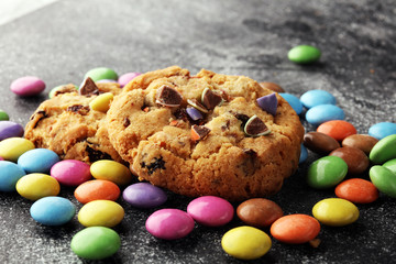 Chocolate cookies with colorful candies. Chocolate chip smarties cookies.